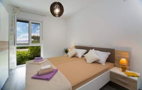 Postel nebo postele na pokoji v ubytování Vacation On Apartments