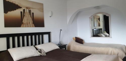 מיטה או מיטות בחדר ב-CASA DE PERSONAS