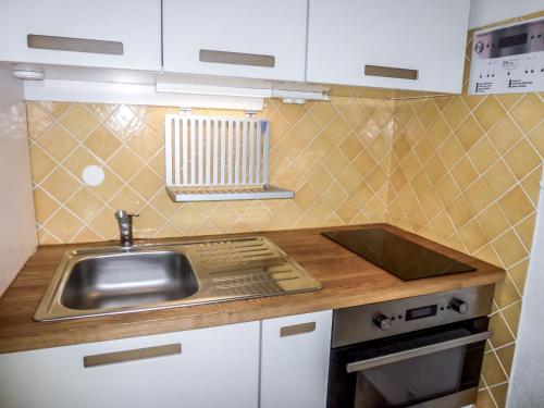 a small kitchen with a sink and a counter at Studio La Lagune by Interhome in Le Grau-du-Roi