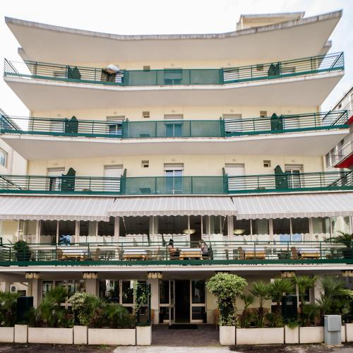 an external view of a building with balconies at Hotel Plaza in Rimini