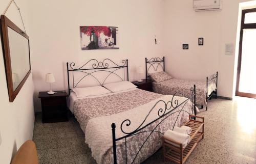 Postel nebo postele na pokoji v ubytování Masseria 77