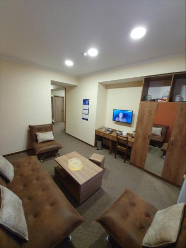 a large living room with a couch and a table at 5 Rooms near 300 Aragveli metro station in Tbilisi City