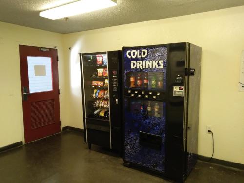 a vending machine with cold drinks in a room at InTown Suites Extended Stay Dallas TX - North Richland Hills in North Richland Hills