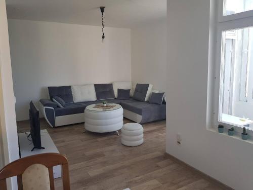 a living room with a couch and a table at Montenegro Calling in Bijela