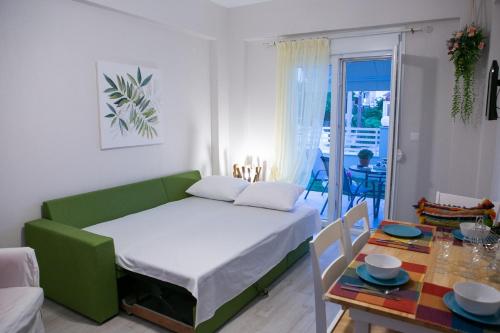 a small room with a bed and a table at Mihail in Nikiti
