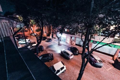 a group of cars parked in a parking lot at Je T'aime Porto Sweet Rooms in Vila Nova de Gaia