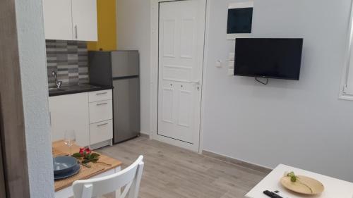 Kuchyň nebo kuchyňský kout v ubytování Villa Kallimanis