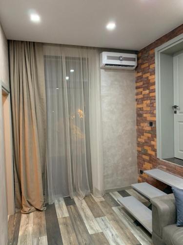 En eller flere senge i et værelse på Loft Batumi