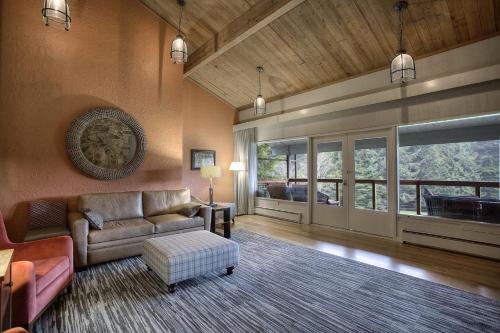 a living room with a couch and a table at Salishan Coastal Lodge by SCP Hotels in Lincoln City