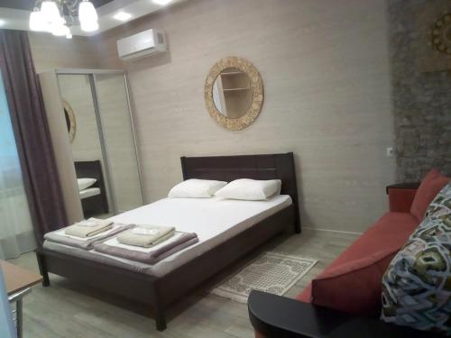 Кровать или кровати в номере Керченский дворик