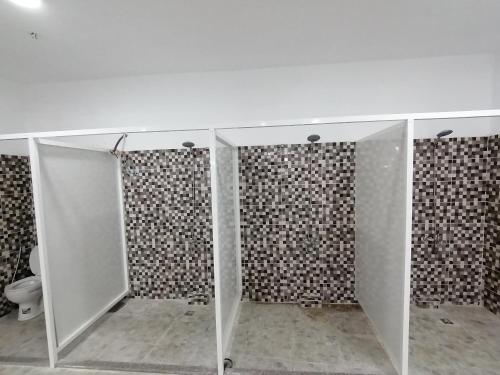 a bathroom with a glass counter with a toilet at Weekend Hotel in Aqaba