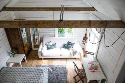 a living room with a white couch and a table at Westergårds in Föglö