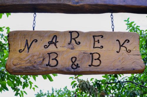 a wooden sign with the words marilyn babylon at Narek B&B in Goris