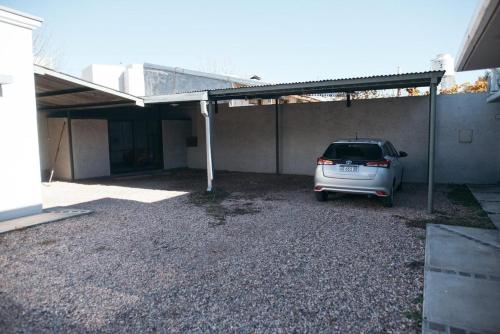 a car parked in a parking lot next to a building at Rincon Secreto in San Rafael