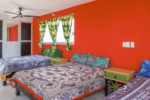 Säng eller sängar i ett rum på Hotel Puerto Viejo
