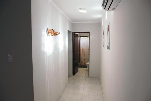 a hallway with a hallway leading to a bathroom at Rincon Secreto in San Rafael