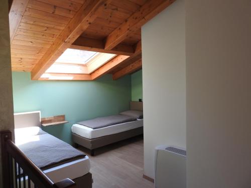 A bed or beds in a room at Appartamenti Tasel with heated Pool