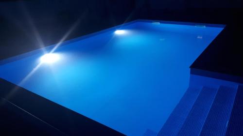 a blue table with lights on top of it at Vila NINA in Gospić