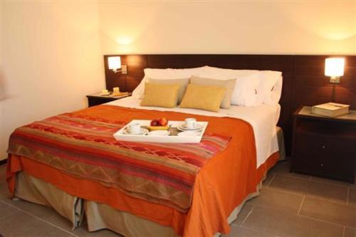 En eller flere senge i et værelse på Apartamentos en Agua Calma