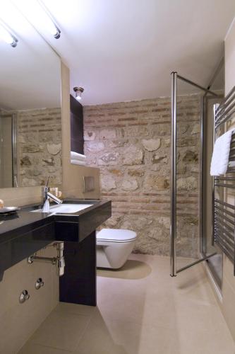 a bathroom with a toilet and a sink and a shower at Hotel Vestibul Palace & Villa - Small Luxury Hotels Of The World in Split