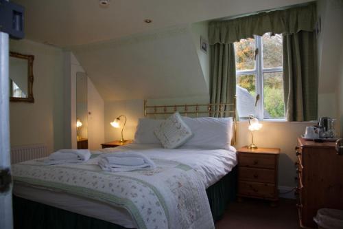 Un pat sau paturi într-o cameră la Dunchraigaig House