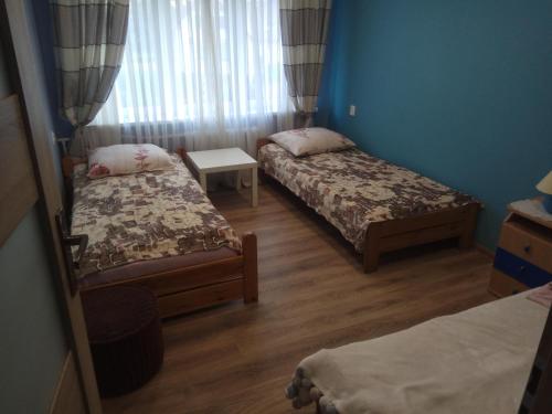 A bed or beds in a room at Pokoje gościnne u Sławka
