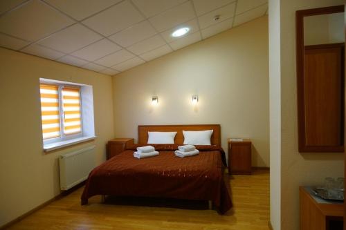 Postel nebo postele na pokoji v ubytování Hotel Nova