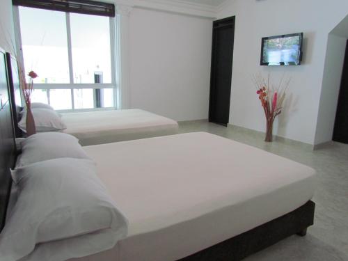 Hotel Iraqúaにあるベッド