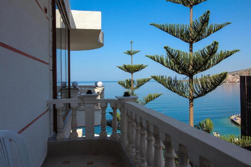 a balcony with a view of the water at Apartments Romario in Sarandë
