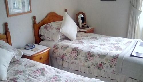 Un pat sau paturi într-o cameră la Aydon House
