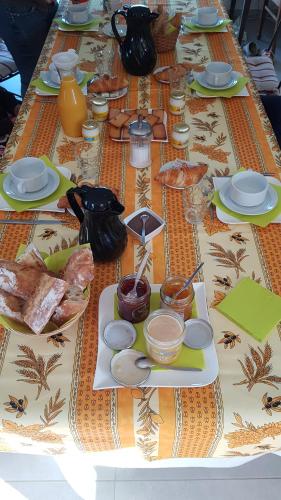 a table topped with plates of food on top at Alolival in Sablonceaux