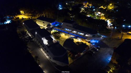 an aerial view of a building at night at Puerto Plaza Las Terrenas in Las Terrenas