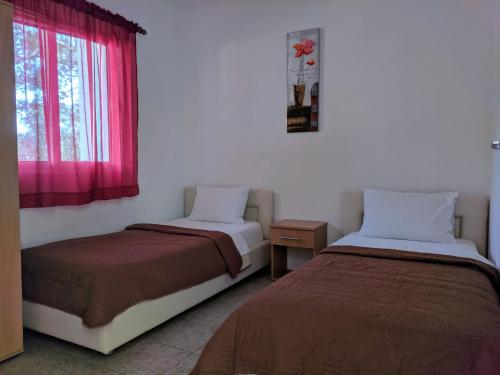 Postel nebo postele na pokoji v ubytování Beni Bungalows