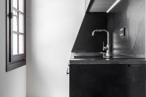 Kuchyň nebo kuchyňský kout v ubytování Chacón Apartments & Suites