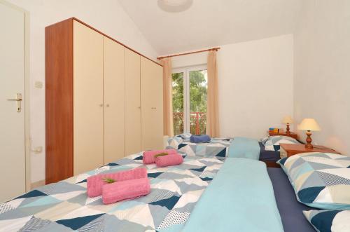 Postel nebo postele na pokoji v ubytování Apartment House Juretic - 50 m from the beach