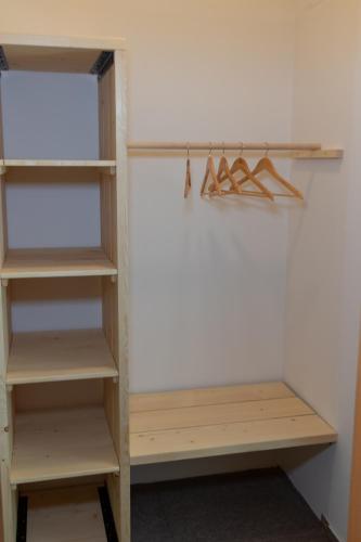 a closet with wooden shelves in a room at Natura in Trenčianske Teplice