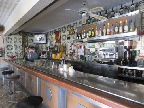 a bar with a counter in a restaurant at Hotel Alain in Silla