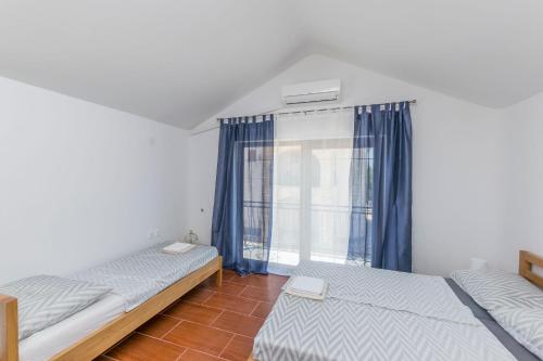 En eller flere senge i et værelse på House Paklenica Stone I