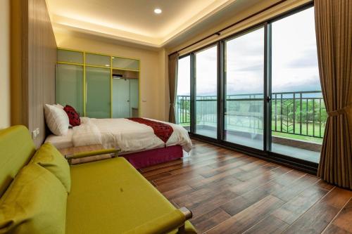 a hotel room with a bed and a large window at 123 Hall in Wujie