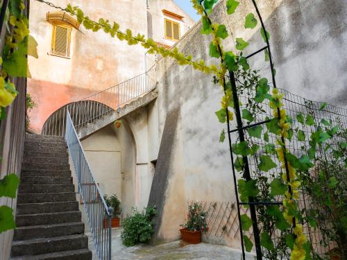 a stairway leading up to a building with stairs at Al Vicolo Stretto in Santa Maria a Vico