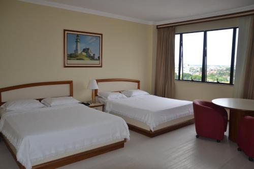 A bed or beds in a room at Hotel Sagres