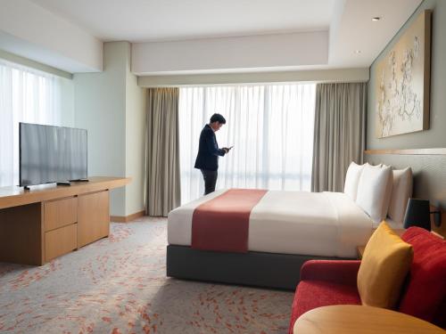 Télévision ou salle de divertissement dans l'établissement Holiday Inn & Suites Jakarta Gajah Mada by IHG