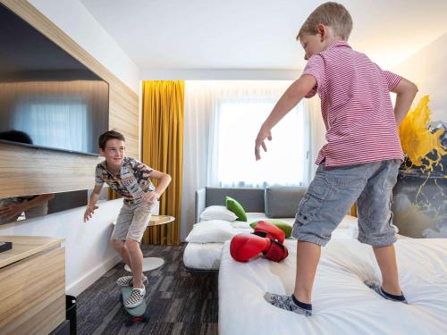 Postel nebo postele na pokoji v ubytování Novotel Annecy Centre