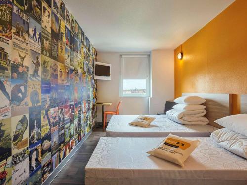 Katil atau katil-katil dalam bilik di hotelF1 Paris Porte de Châtillon