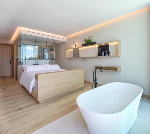Letto o letti in una camera di Noa Boutique Hotel
