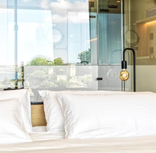 Letto o letti in una camera di Noa Boutique Hotel
