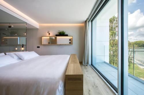 Letto o letti in una camera di Noa Boutique Hotel