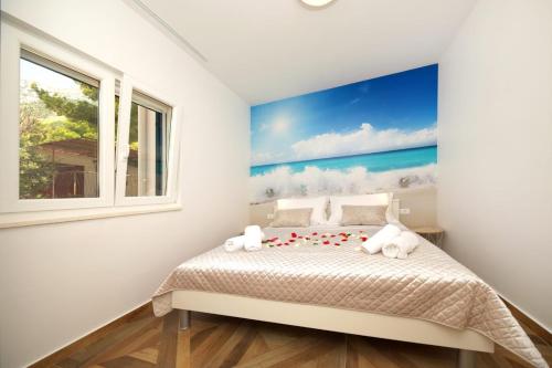 Postel nebo postele na pokoji v ubytování Apartments REDSTONE luxury apartments