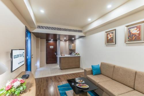 Χώρος καθιστικού στο Golden Suites Gurgaon Inde Hotels
