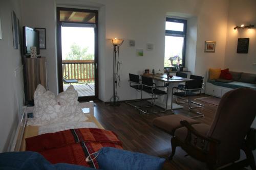 a living room with a couch and a table at Alte Volksschule - schual in gradne in Liebenfels